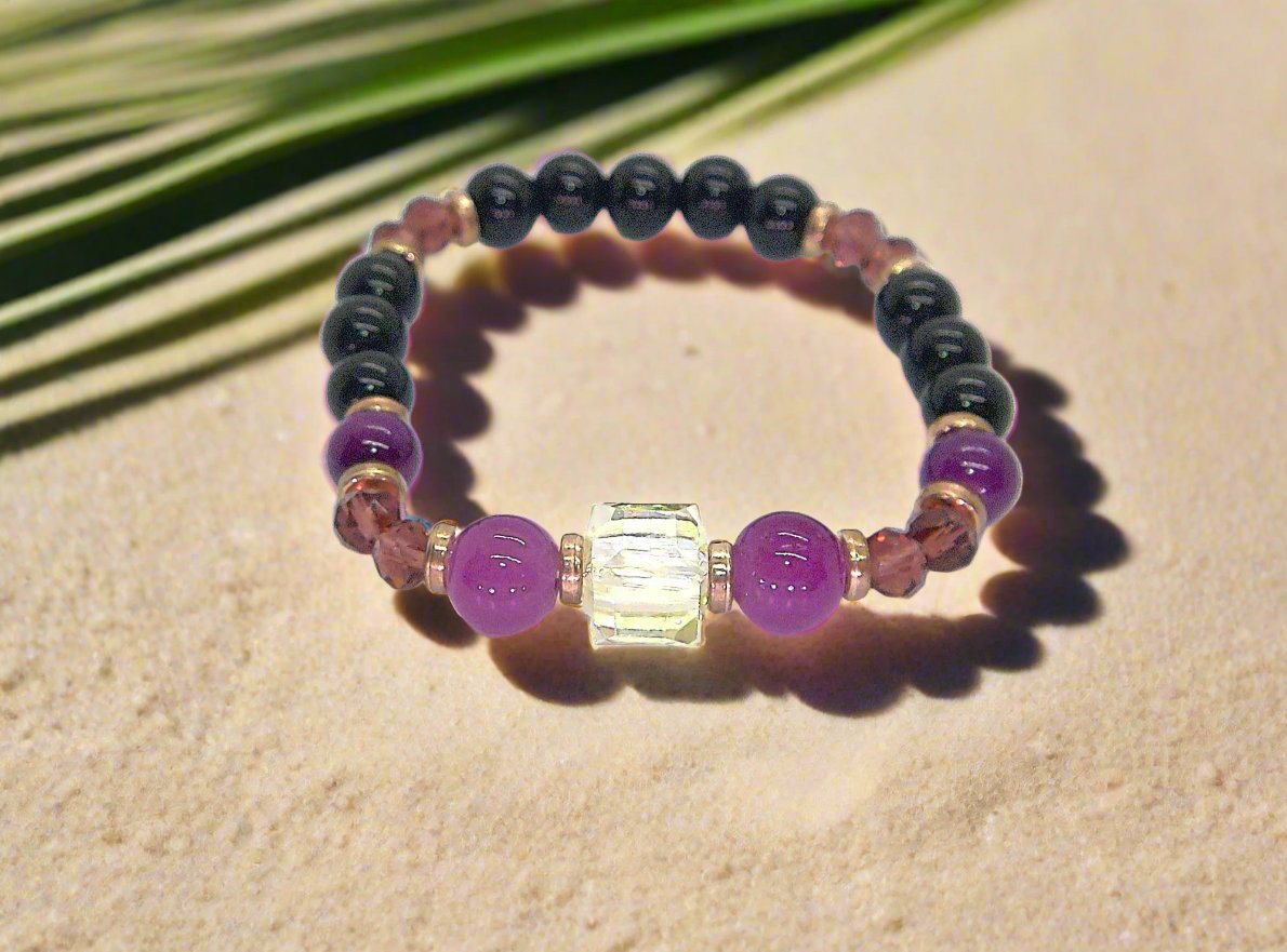Go To: https://www.artistryjewelry.net/products/amethyst-and-black-garnet-yoga-bracelet