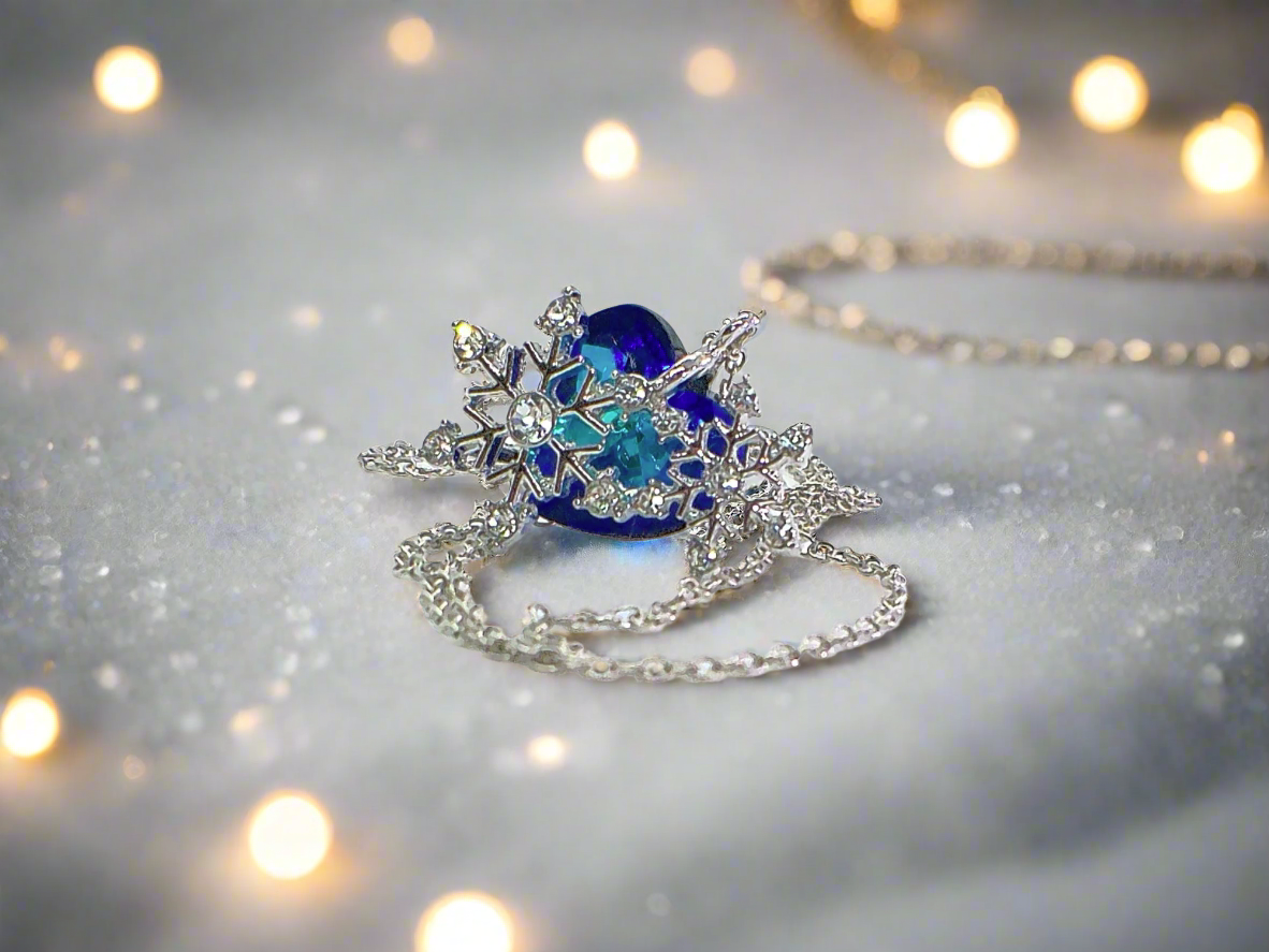 https://www.artistryjewelry.net/products/beautiful-blue-heart-and-snowflake-necklace