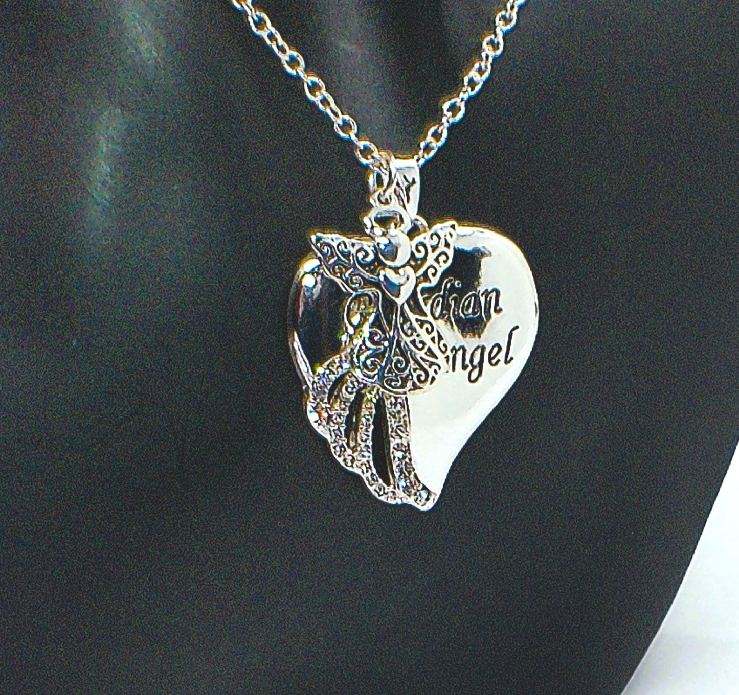 https://www.artistryjewelry.net/products/lovely-guardian-angel-necklace