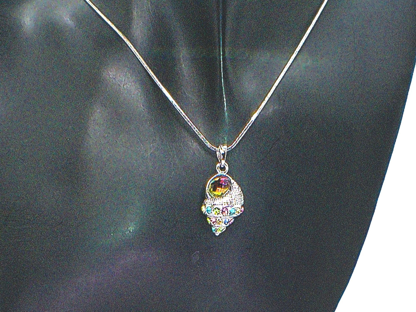https://www.artistryjewelry.net/products/trempet-shell-pendant-necklace