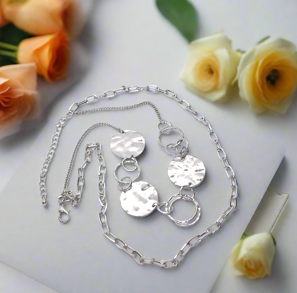 https://www.artistryjewelry.net/products/hammered-disc-necklace