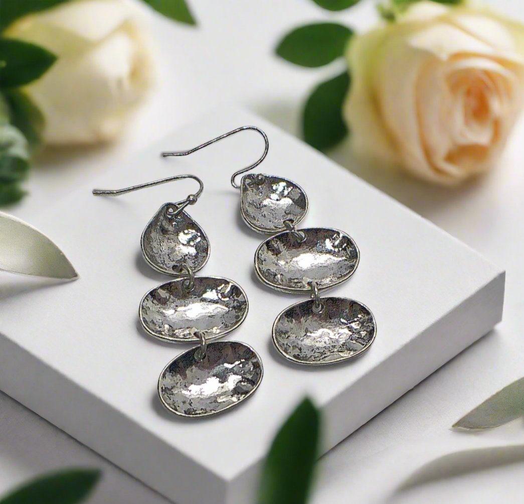 https://www.artistryjewelry.net/products/multi-disc-drop-earrings