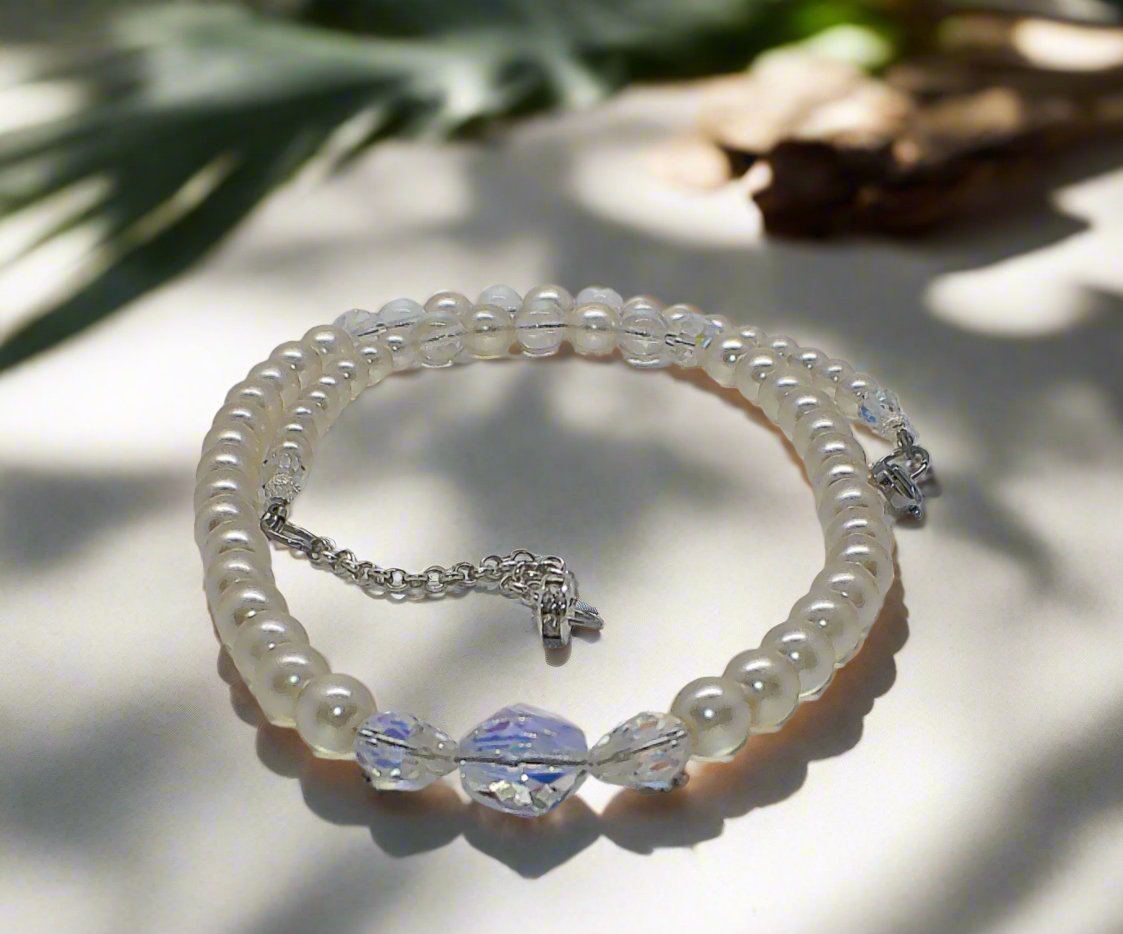 https://www.artistryjewelry.net/products/precious-light-peach-silver-crystal-and-pearl-beaded-necklace-handcrafted-by-artistry-jewelry