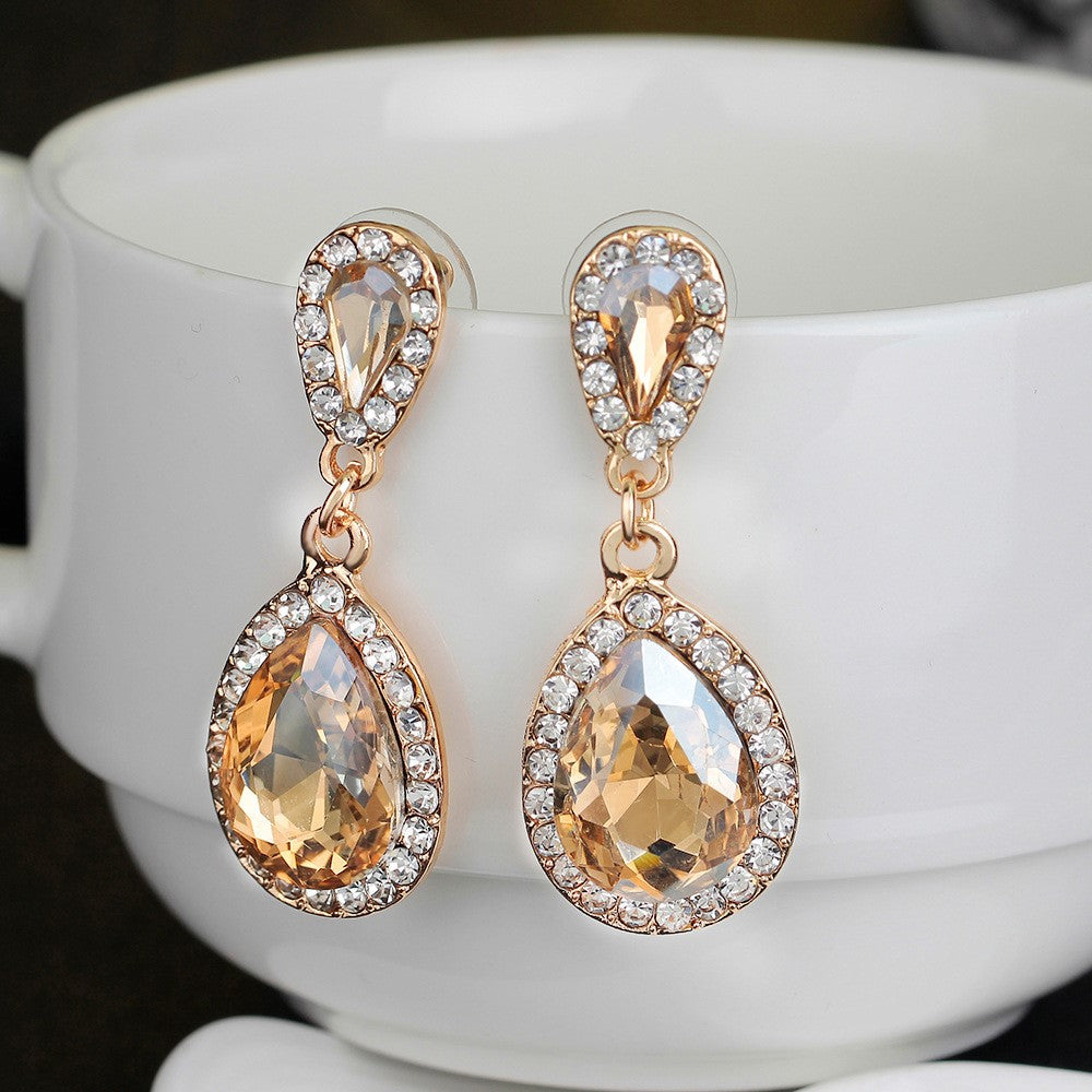 https://www.artistryjewelry.net/products/champagne-teardrop-rhinestone-earrings