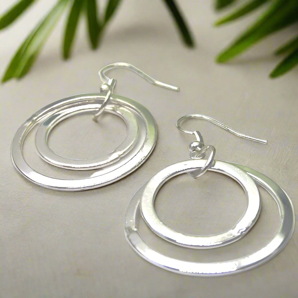 https://www.artistryjewelry.net/products/fantastic-silver-circle-earrings