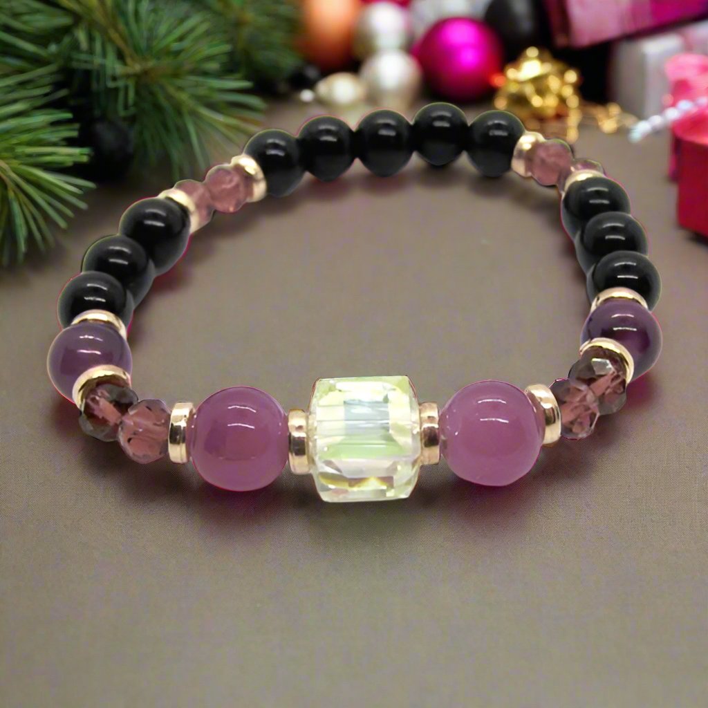 Go To: https://www.artistryjewelry.net/products/amethyst-and-black-garnet-yoga-bracelet