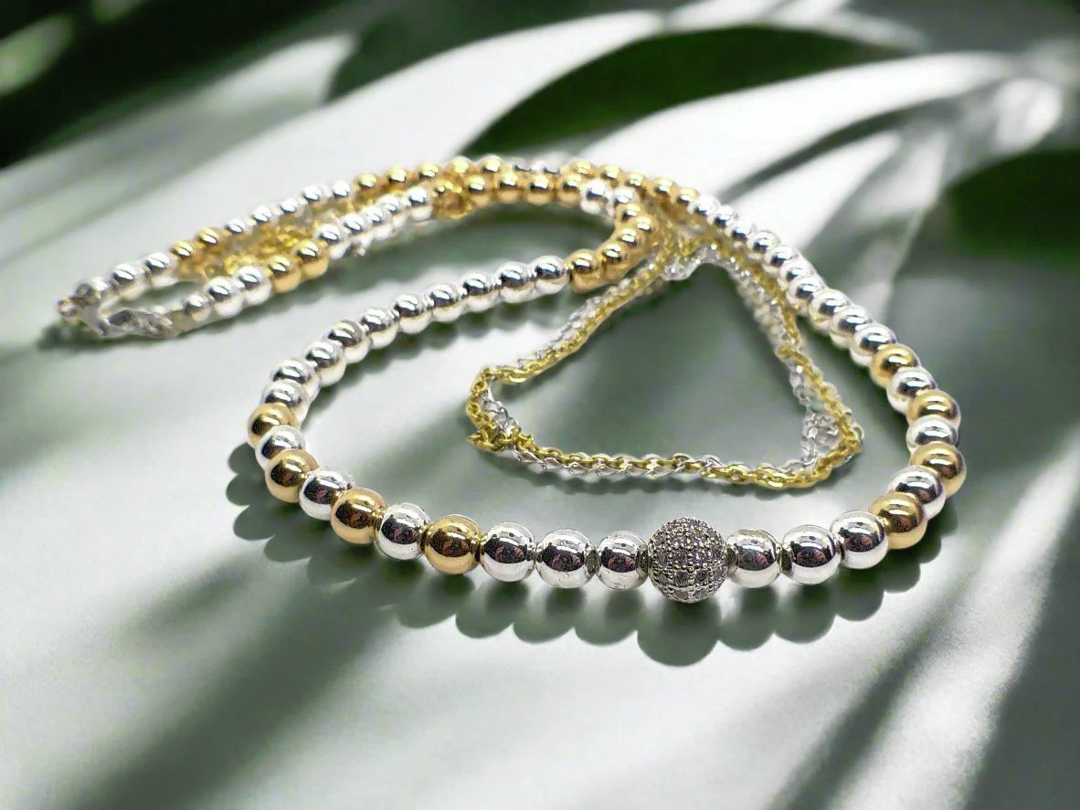 https://www.artistryjewelry.net/products/beautiful-silver-and-gold-hematite-necklace