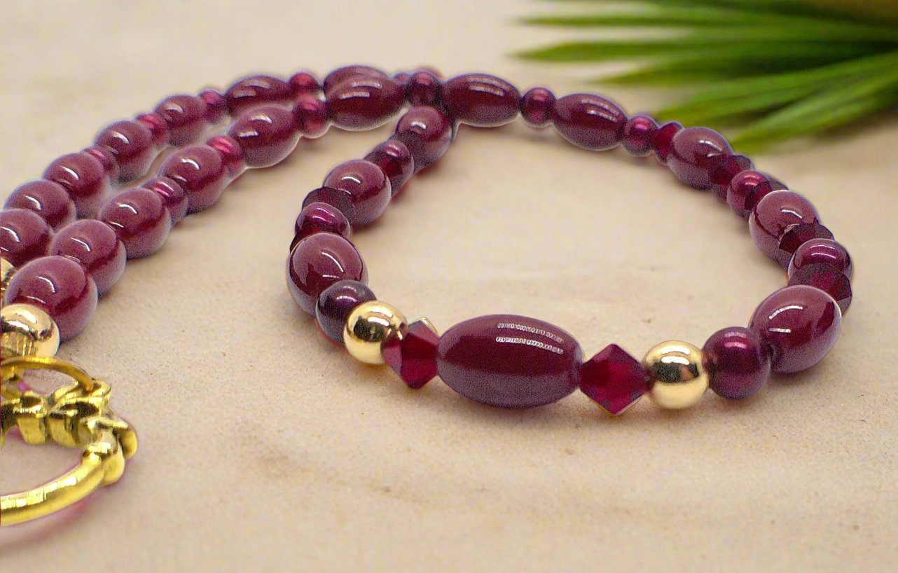 https://www.artistryjewelry.net/products/lovely-burgundy-surprise-necklace