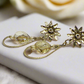 https://www.artistryjewelry.net/products/swarvorski-golden-shadow-earrings