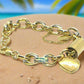 https://www.artistryjewelry.net/products/exciting-puffy-gold-heart-charm-chain-bracelet