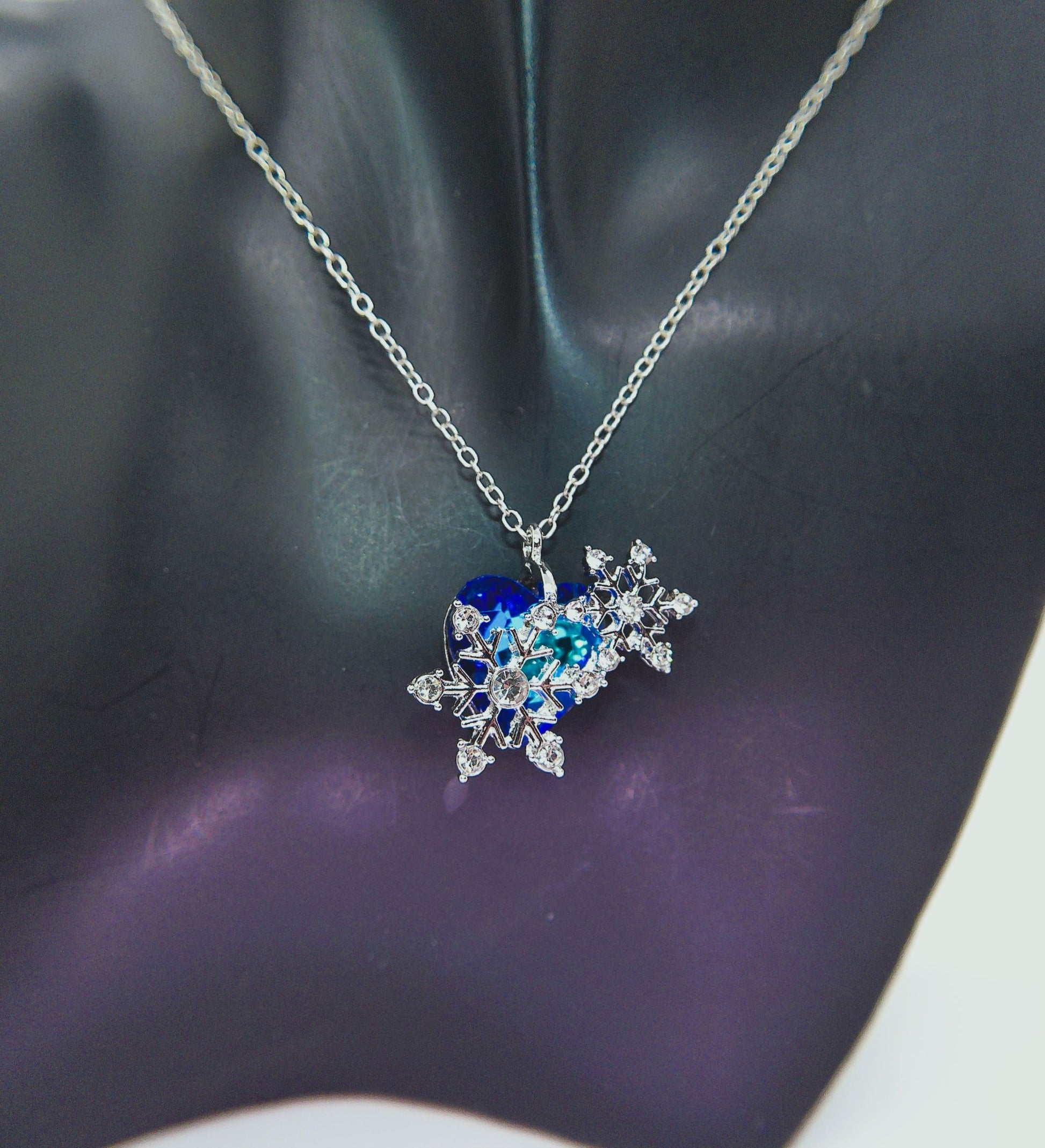 https://www.artistryjewelry.net/products/beautiful-blue-heart-and-snowflake-necklace