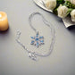 https://www.artistryjewelry.net/products/lovely-blue-winter-snowflake-necklace