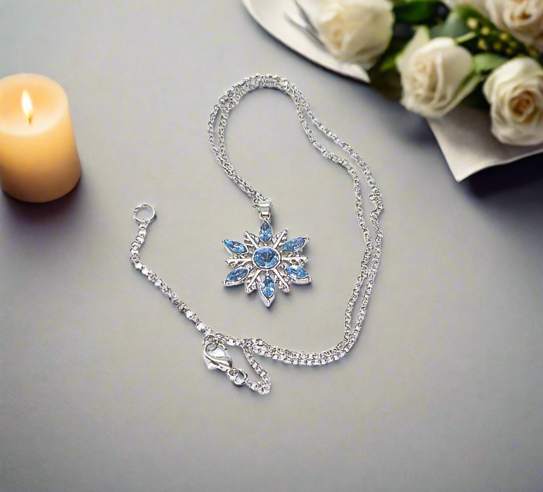 https://www.artistryjewelry.net/products/lovely-blue-winter-snowflake-necklace