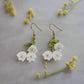 https://www.artistryjewelry.net/products/precious-white-flower-dangle-earrings