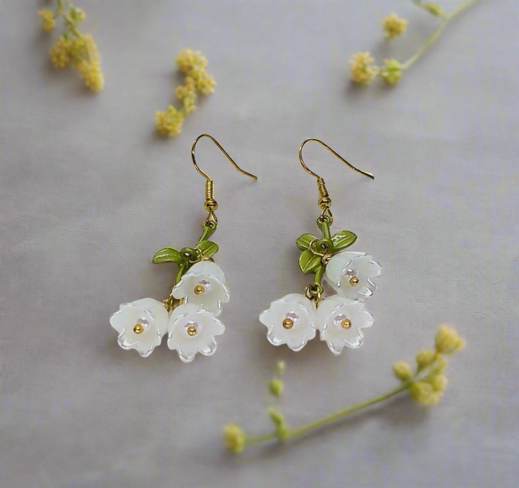 https://www.artistryjewelry.net/products/precious-white-flower-dangle-earrings