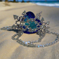 https://www.artistryjewelry.net/products/beautiful-blue-heart-and-snowflake-necklace