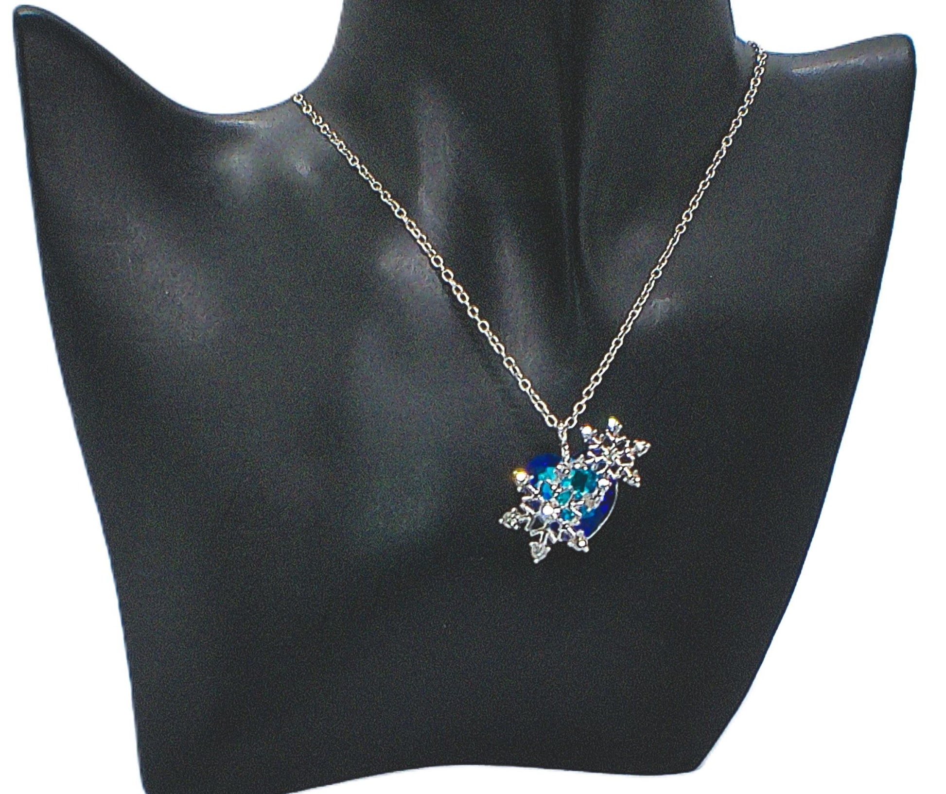 https://www.artistryjewelry.net/products/beautiful-blue-heart-and-snowflake-necklace