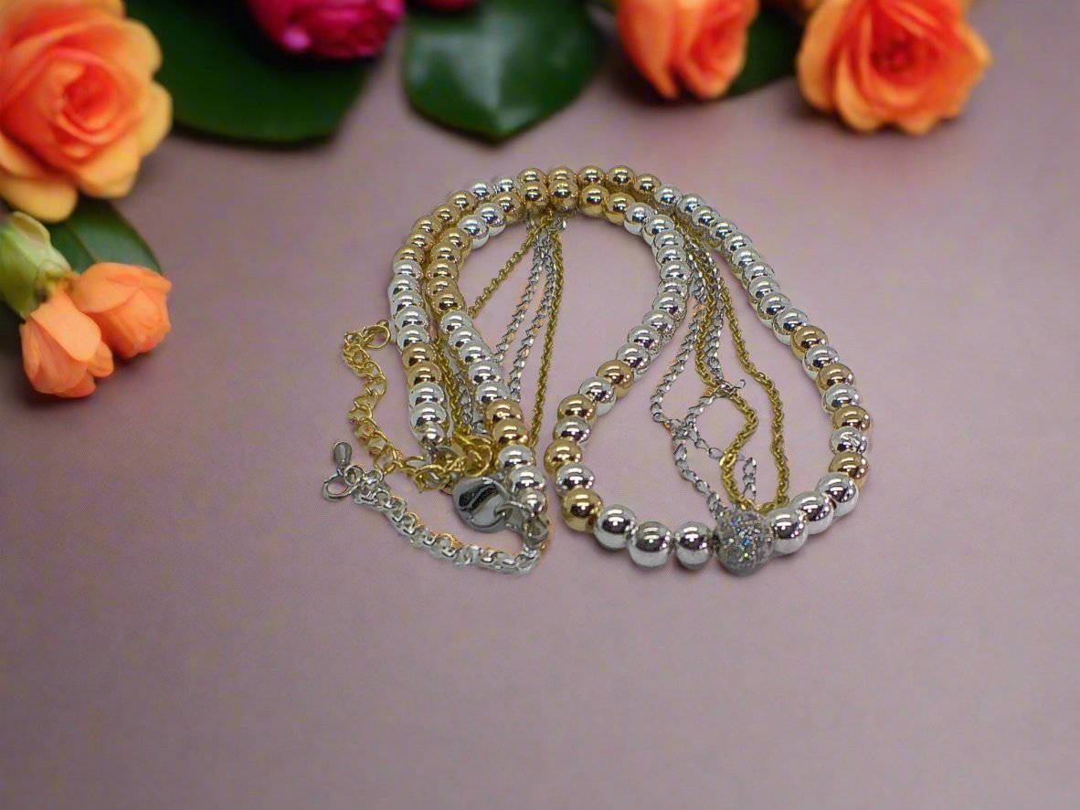 https://www.artistryjewelry.net/products/beautiful-silver-and-gold-hematite-necklace