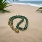 https://www.artistryjewelry.net/products/stunning-olive-green-and-hematite-necklace