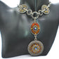 https://www.artistryjewelry.net/products/lovely-chain-and-disc-neckace
