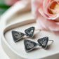 https://www.artistryjewelry.net/products/triangles-and-black-diamonds-earrings