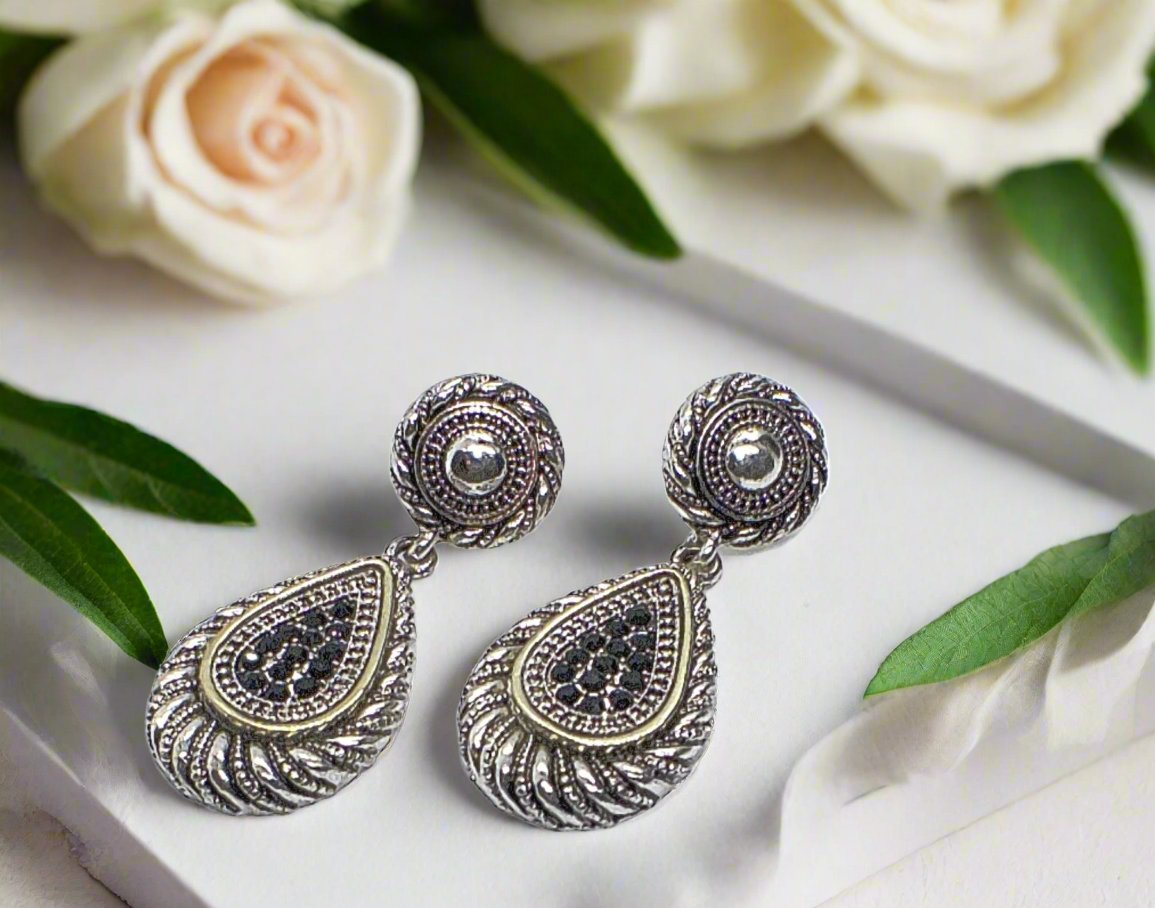 https://www.artistryjewelry.net/products/silver-swirl-earrings