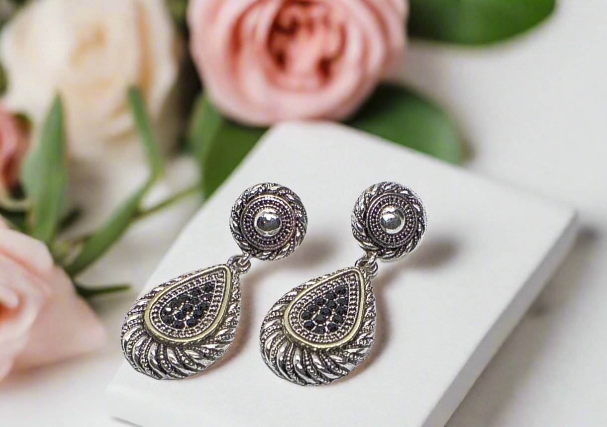https://www.artistryjewelry.net/products/silver-swirl-earrings