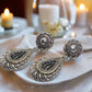 https://www.artistryjewelry.net/products/silver-swirl-earrings