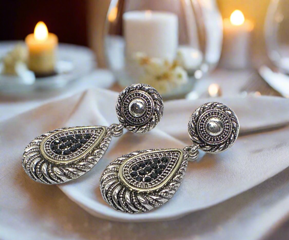 https://www.artistryjewelry.net/products/silver-swirl-earrings