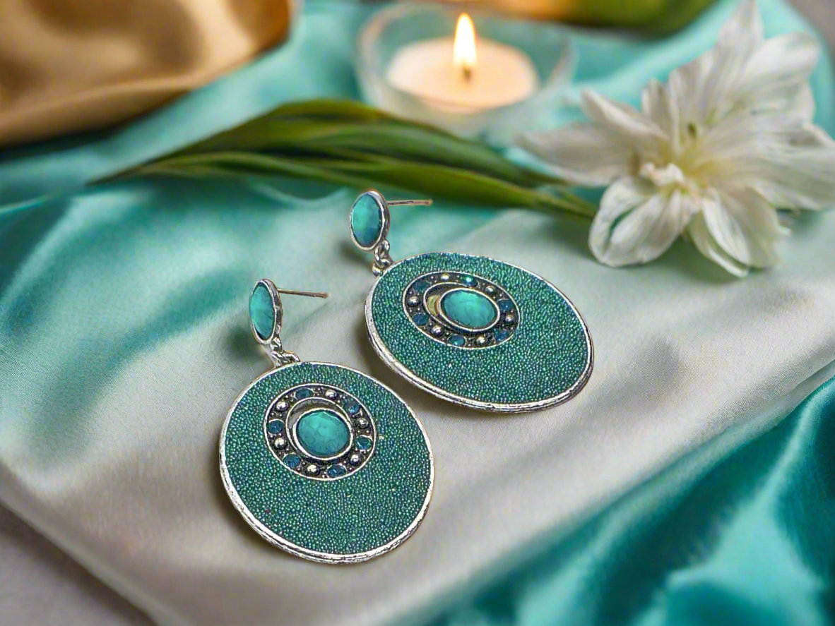 https://www.artistryjewelry.net/products/teal-earrings