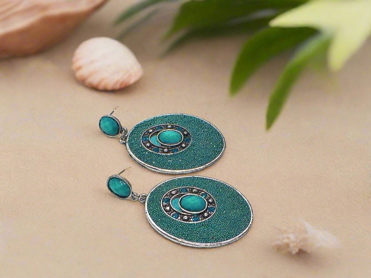 https://www.artistryjewelry.net/products/teal-earrings