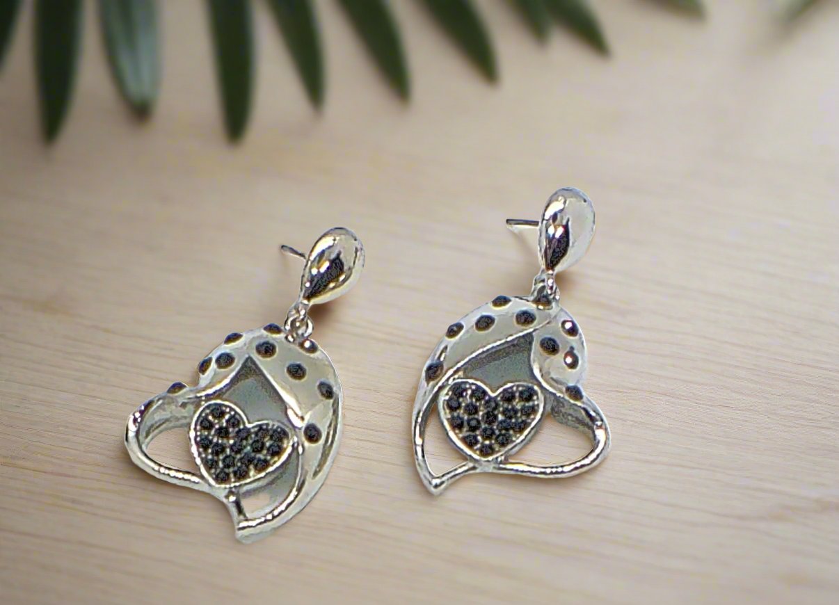https://www.artistryjewelry.net/products/double-crystal-heart-earrings