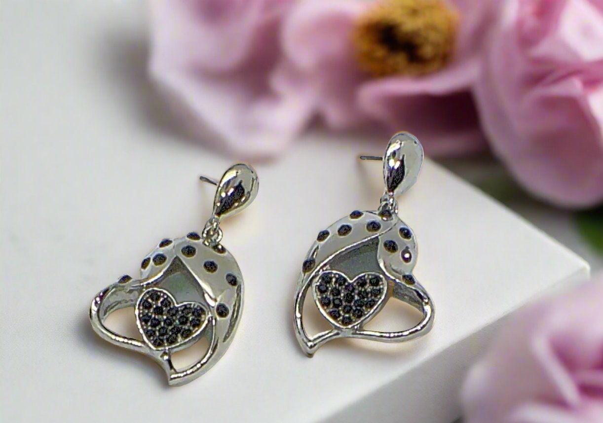 https://www.artistryjewelry.net/products/double-crystal-heart-earrings