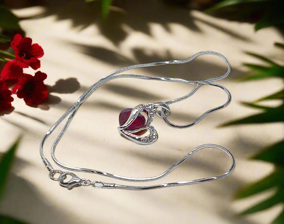 https://www.artistryjewelry.net/products/red-crystal-heart-necklace