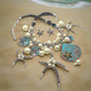 https://www.artistryjewelry.net/products/starfish-and-shell-statement-necklaces-set