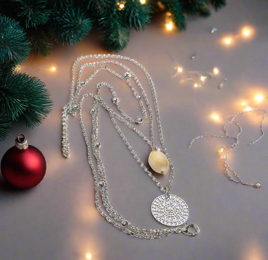 https://www.artistryjewelry.net/products/silver-shell-multilayer-necklace
