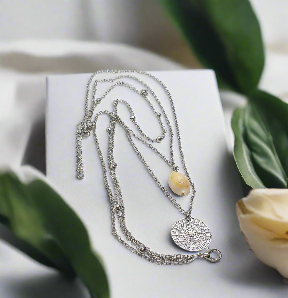 https://www.artistryjewelry.net/products/silver-shell-multilayer-necklace