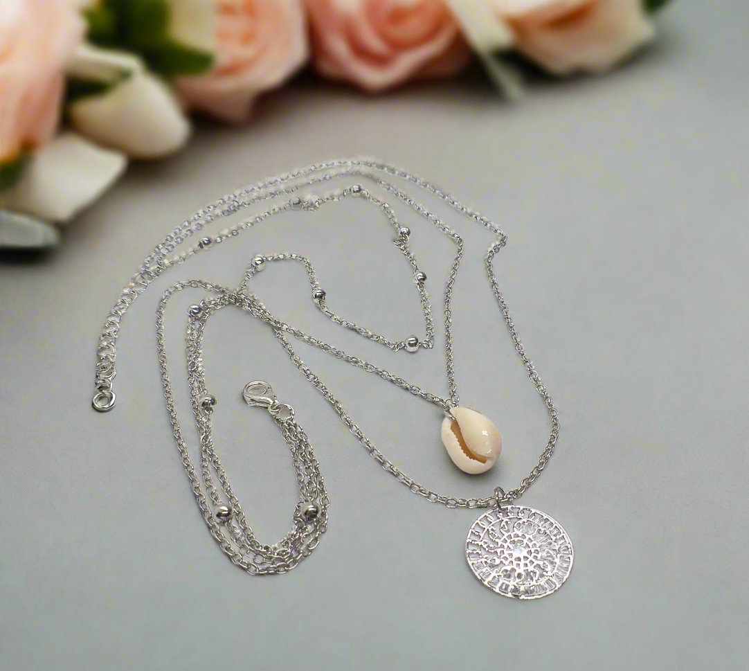https://www.artistryjewelry.net/products/silver-shell-multilayer-necklace