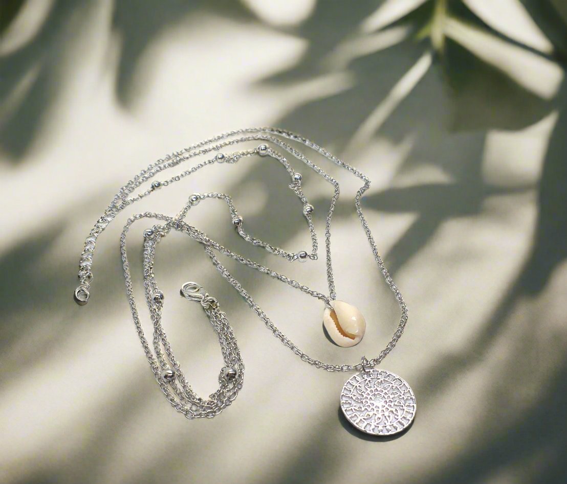 https://www.artistryjewelry.net/products/silver-shell-multilayer-necklace