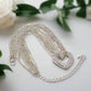 https://www.artistryjewelry.net/products/multi-chain-pave-heart-necklace