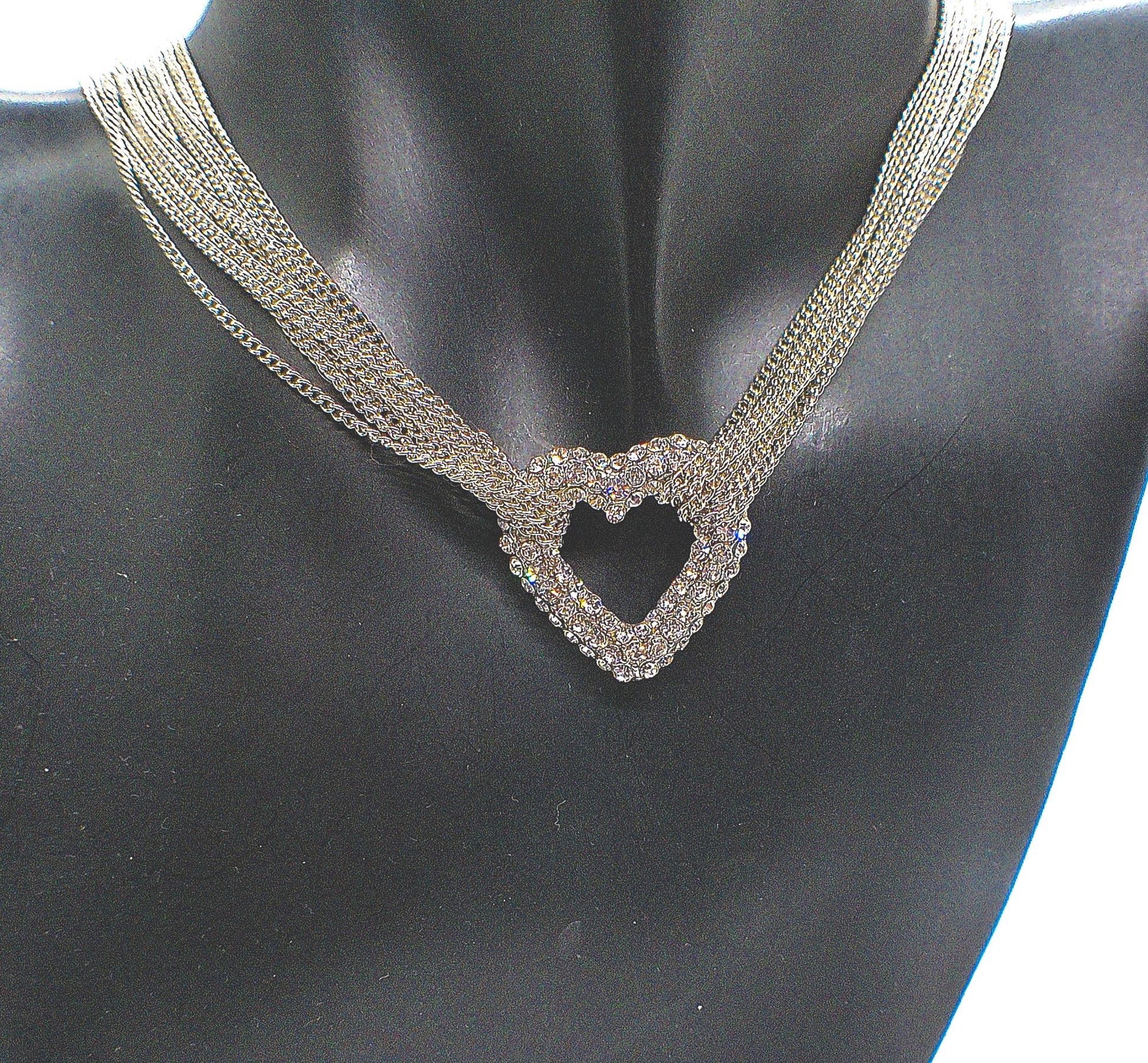 https://www.artistryjewelry.net/products/multi-chain-pave-heart-necklace