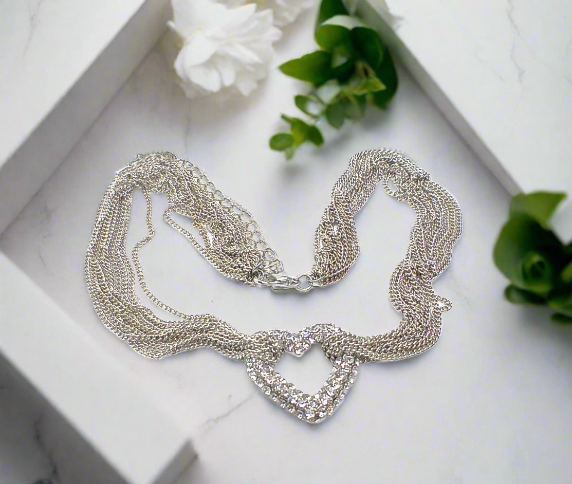 https://www.artistryjewelry.net/products/multi-chain-pave-heart-necklace