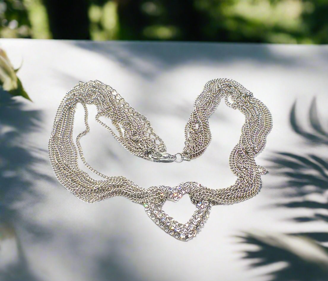 https://www.artistryjewelry.net/products/multi-chain-pave-heart-necklace