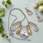 https://www.artistryjewelry.net/products/lovely-metal-fan-necklace-set
