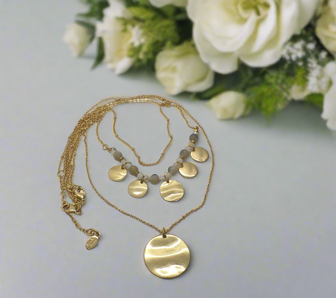 https://www.artistryjewelry.net/products/lovely-beige-multi-strand-necklace