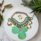 https://www.artistryjewelry.net/products/green-patina-dangle-necklace-set