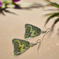https://www.artistryjewelry.net/products/lovely-green-glitter-earrings