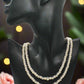 https://www.artistryjewelry.net/products/beautiful-light-peach-stardust-and-pearl-two-strand-beaded-necklace-handcrafted-by-artistry-jewelry