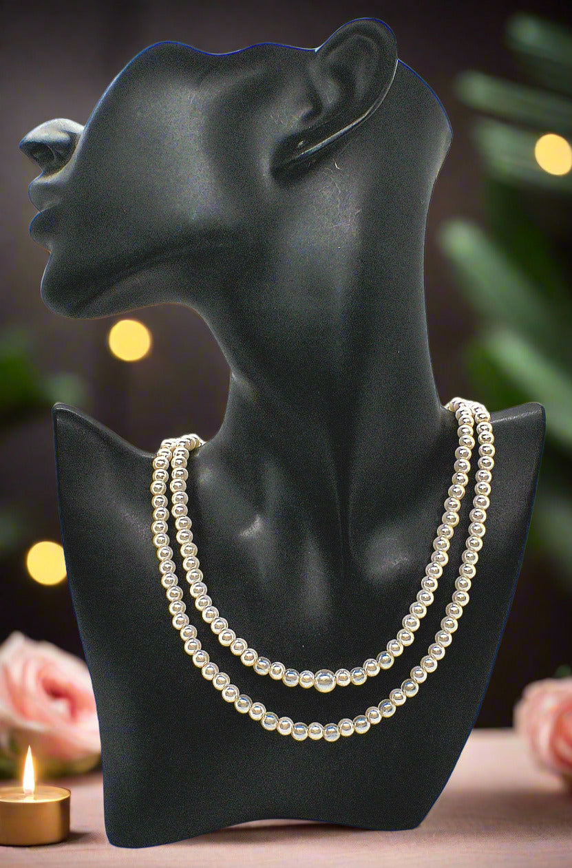 https://www.artistryjewelry.net/products/beautiful-light-peach-stardust-and-pearl-two-strand-beaded-necklace-handcrafted-by-artistry-jewelry