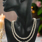 https://www.artistryjewelry.net/products/beautiful-light-peach-stardust-and-pearl-two-strand-beaded-necklace-handcrafted-by-artistry-jewelry